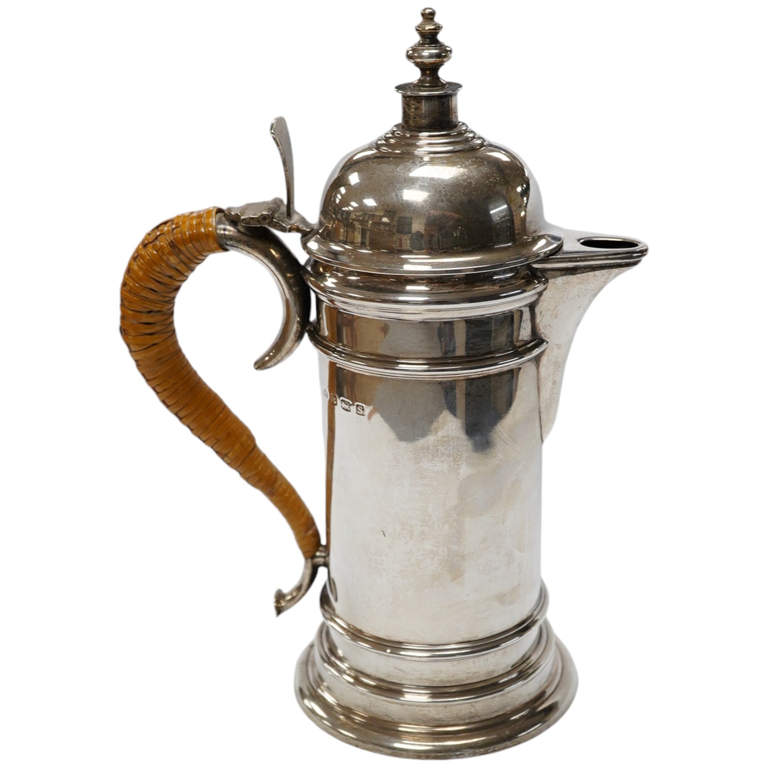 A George V silver cylindrical coffee pot, with a wicker handle, Birmingham, 1917 by Elkington & Co, 25.6cm, gross weight 23.1oz. Condition - fair